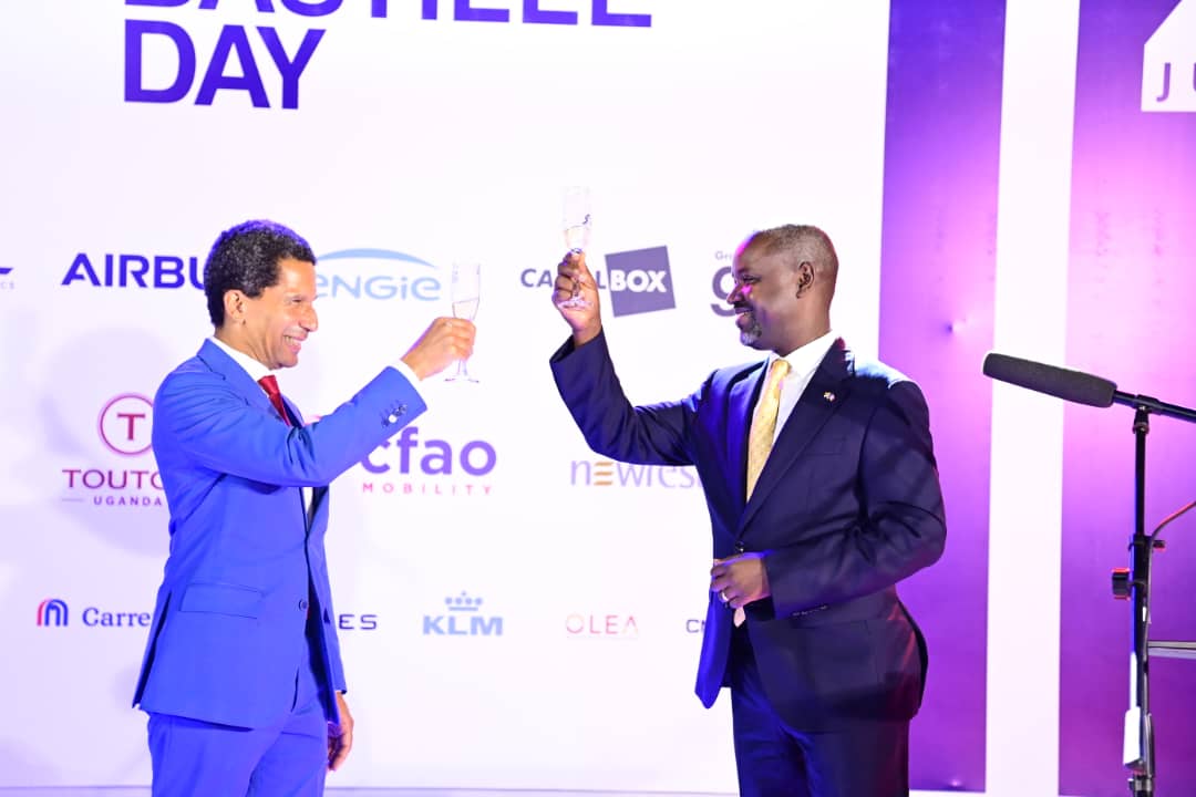 Deputy Speaker, Thomas Tayebwa (right) toasts with the French Ambassador to Uganda, Xavier Sticker, on the commemoration of the Bastille Day on Friday, 12 July 2024