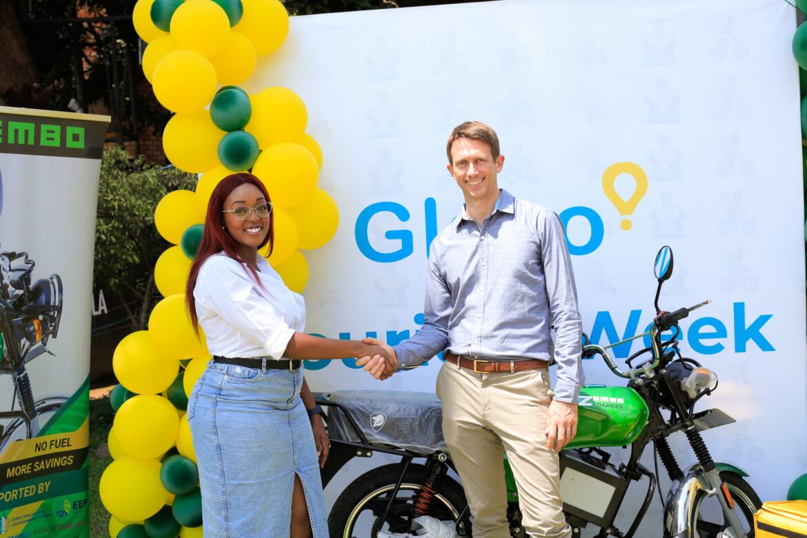 Ivy Maingi, Glovo Uganda General Manager and James Obarawski CEO Zembo Electric Bikes at the launch of their partnership